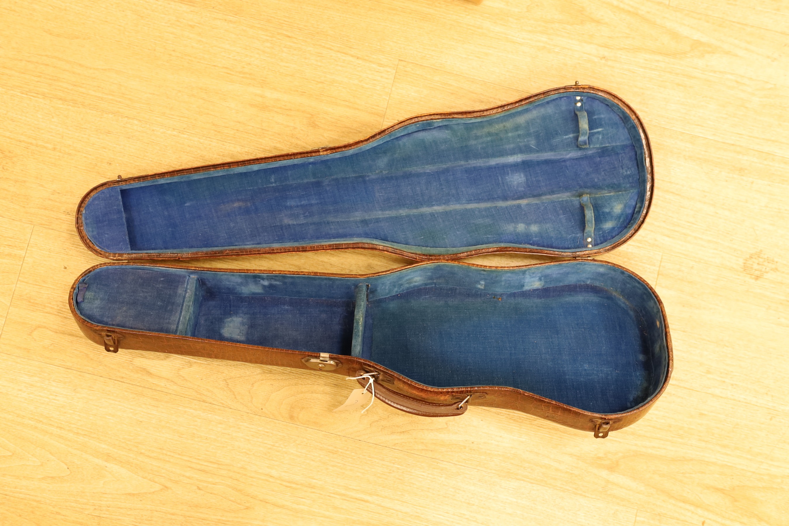 A crocodile skin violin case, formerly belonging to Jim Taylor of Lewes